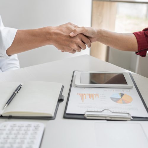 Meeting and greeting concept, Business casual handshake and business people after discussing good deal of Trading contract and new projects for both companies, success, partnership, co worker.